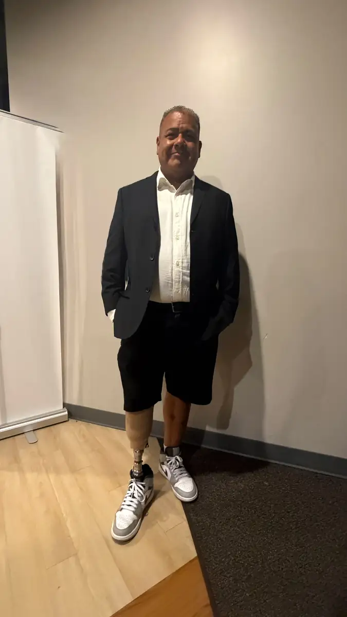 A patient walking the runway at the Quantum Clinics Fashion Show