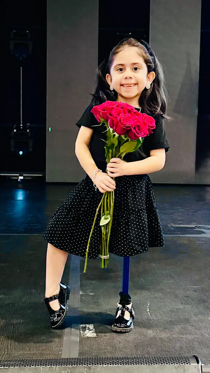 A young patient on stage at the Quantum Clinics Fashion Show