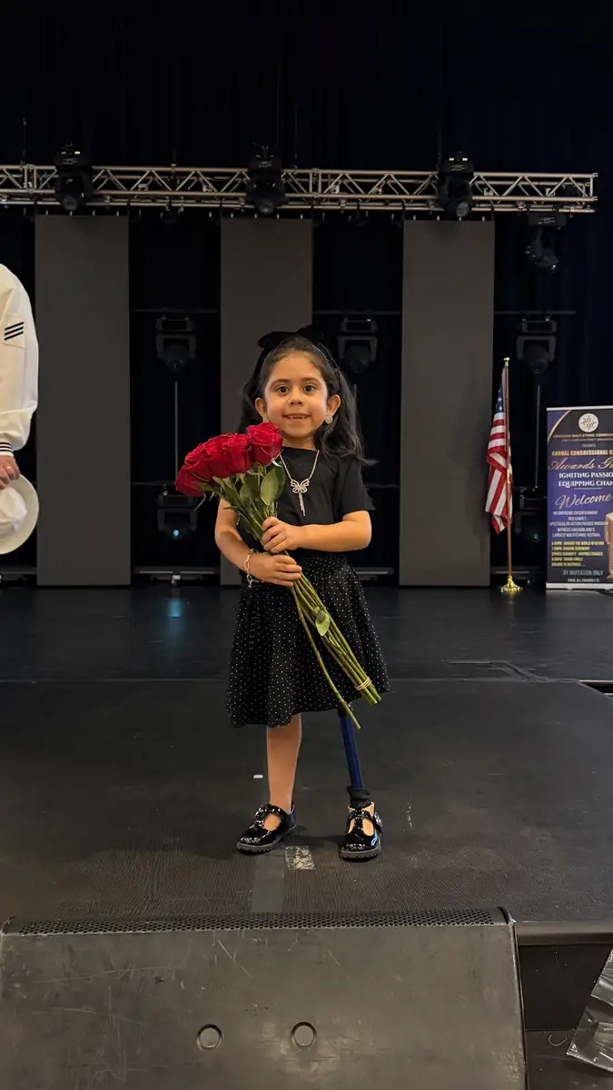 A young patient on the runway at the Quantum Clinics Fashion Show