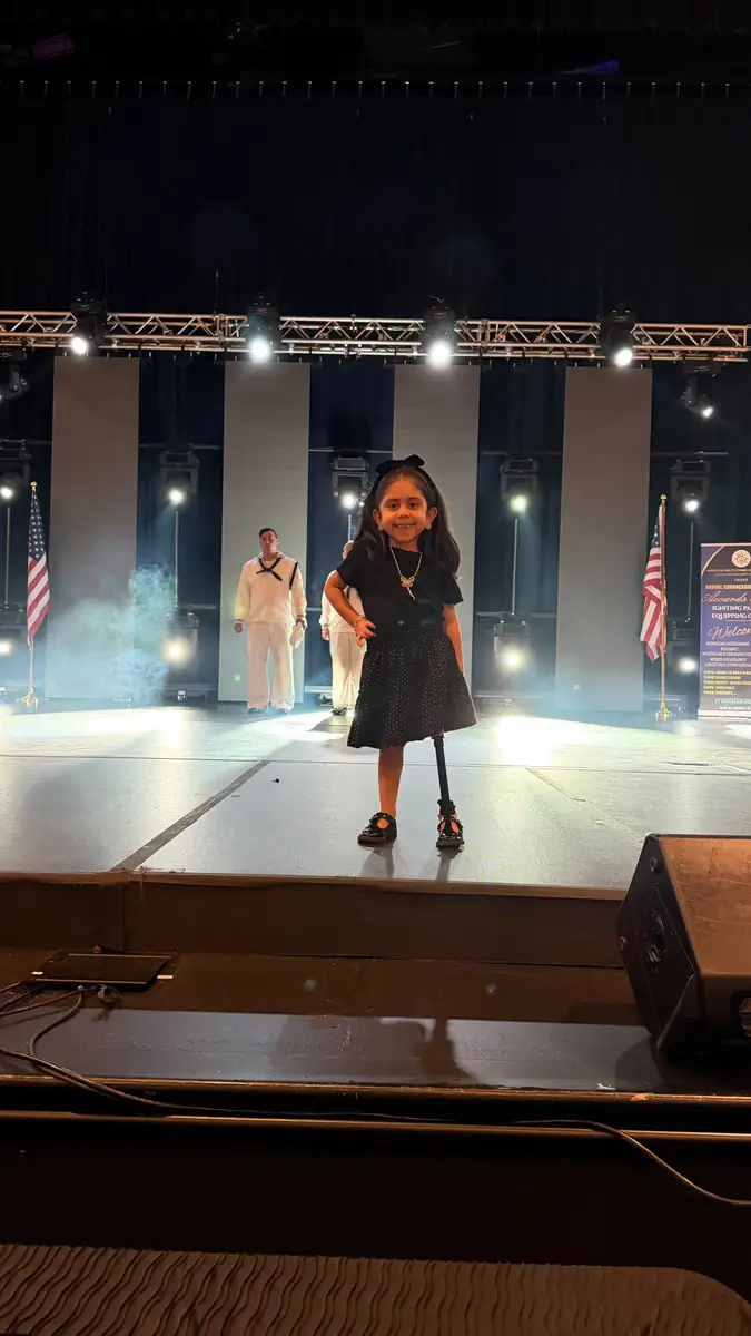 A young patient walking the runway at the Quantum Clinics Fashion Show