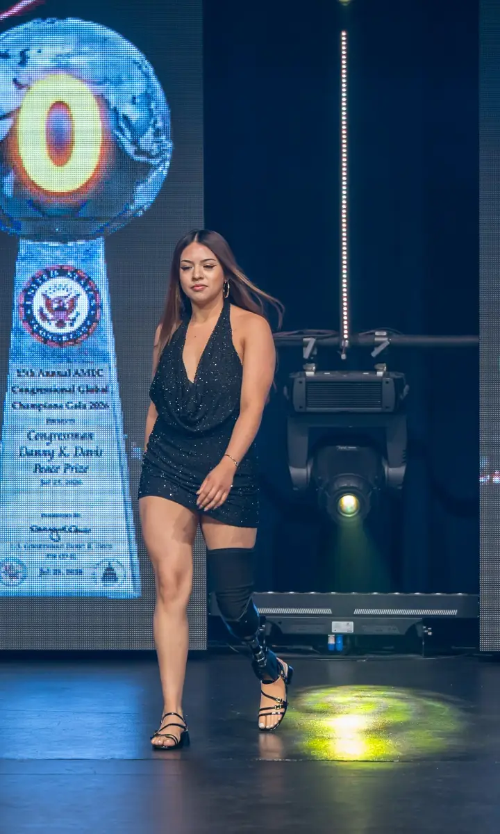 A patient walking the runway at the Quantum Clinics Fashion Show