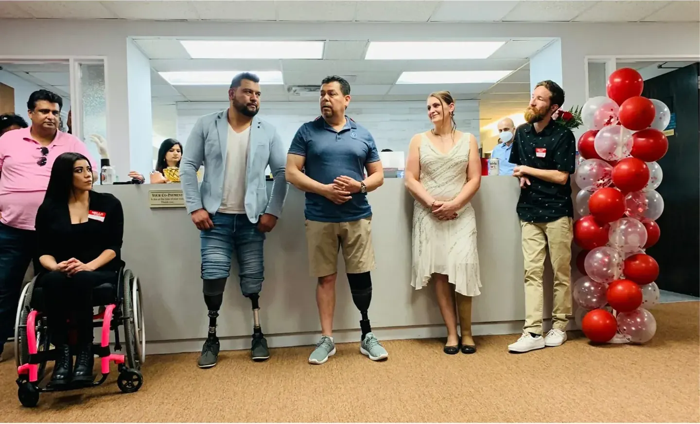 The Quantum Prosthetics & Orthotics team with patients across our clinics.